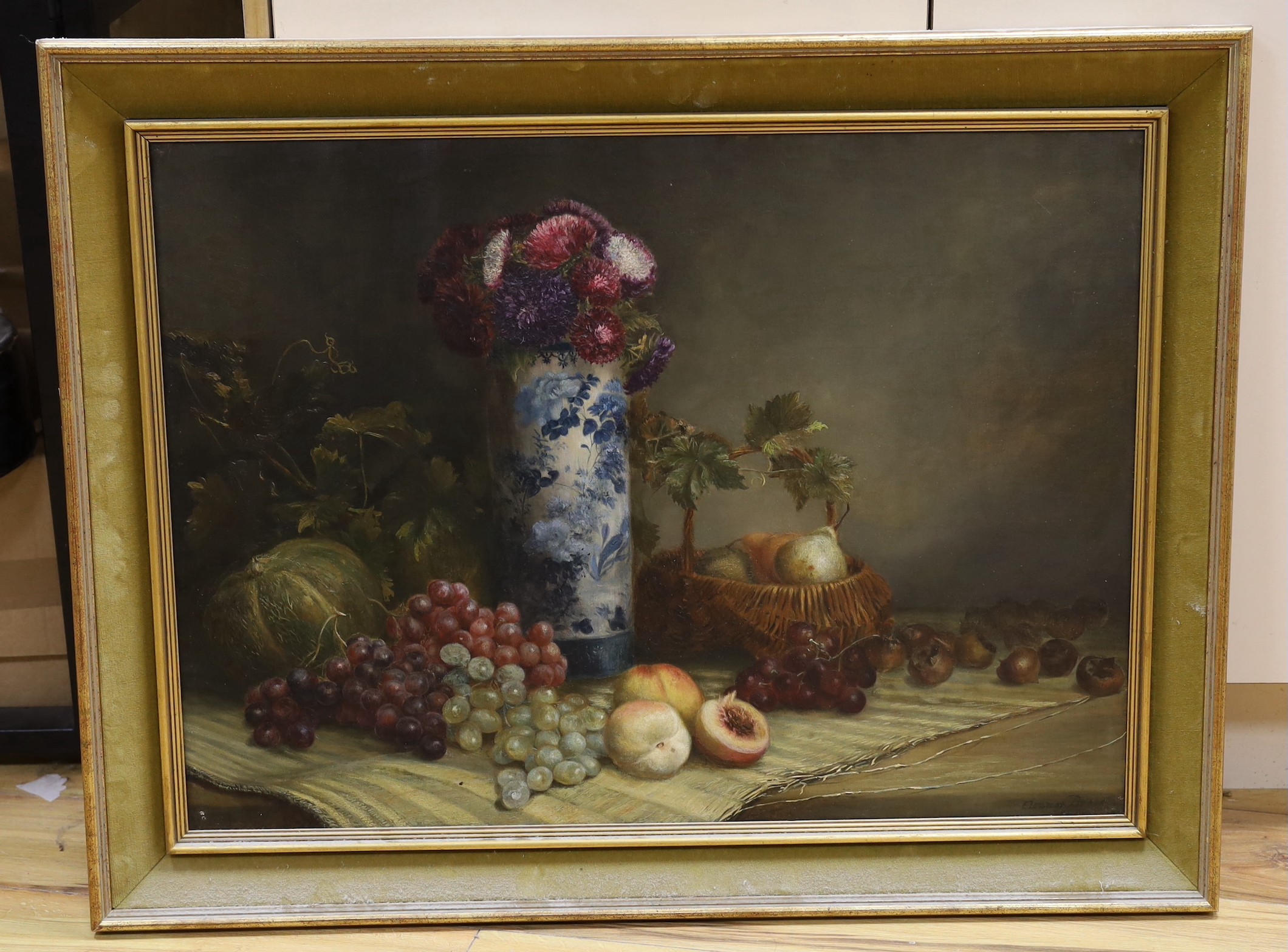 Eleanor Brace of Brighton (19th C.), oil on canvas, Still life of chrysanthemums in a vase and fruit on a table top including medlars, signed, 56 x 76cm